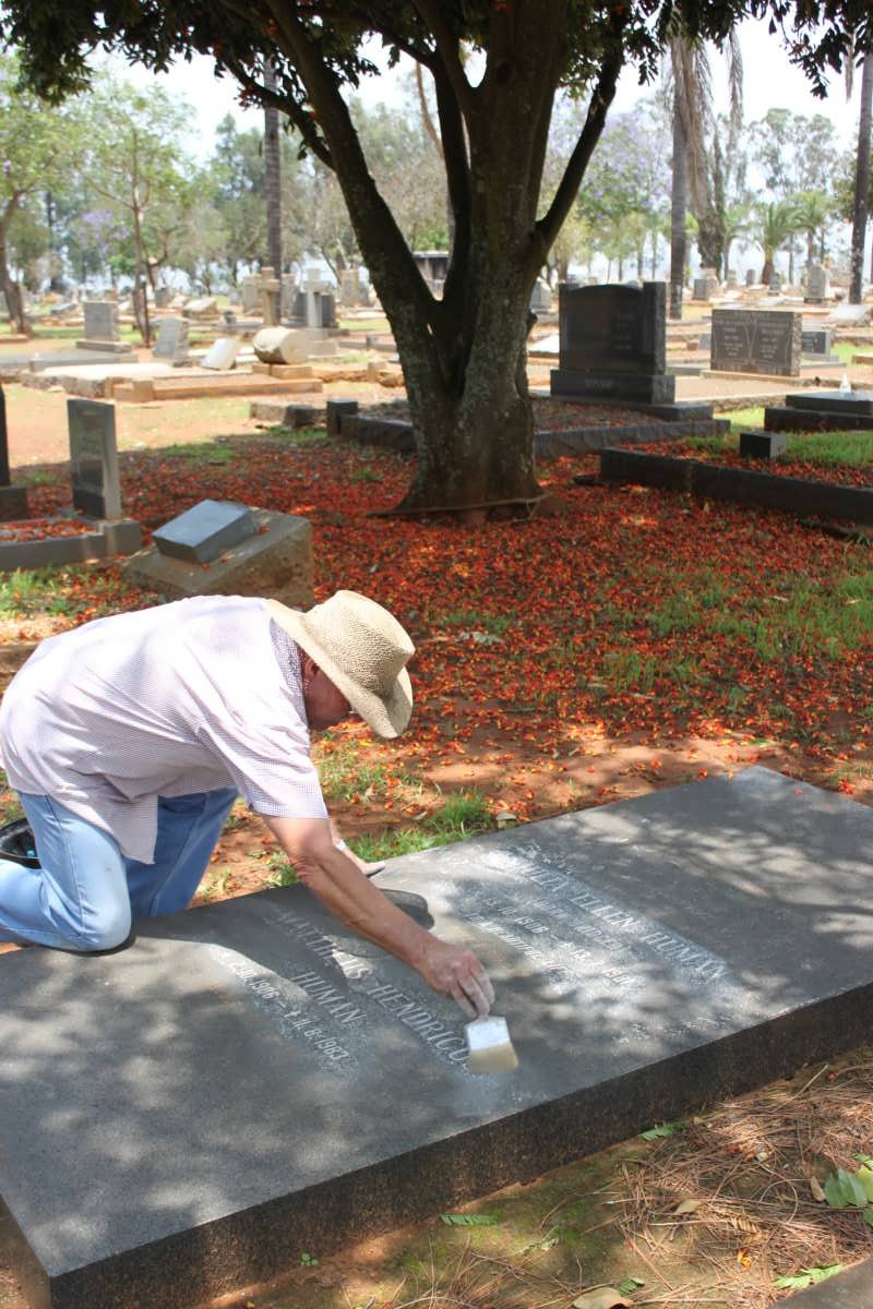 08. Photographer restoring an unclear inscription